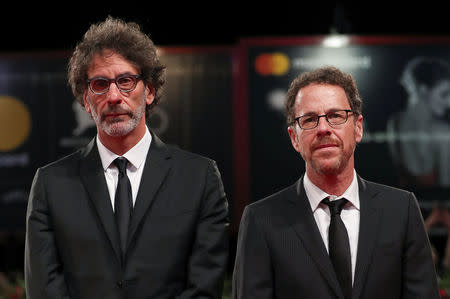 The 75th Venice International Film Festival - ?Screening of the film "The Ballad of Buster Scruggs" competing in the Venezia 75 section - Red Carpet Arrivals - Venice, Italy, August 31, 2018 - Directors Ethan Coen and Joel Coen pose. REUTERS/Tony Gentile