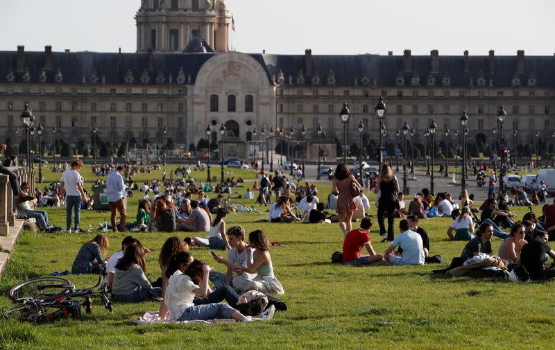 People enjoy a sunny and warm weather in Paris