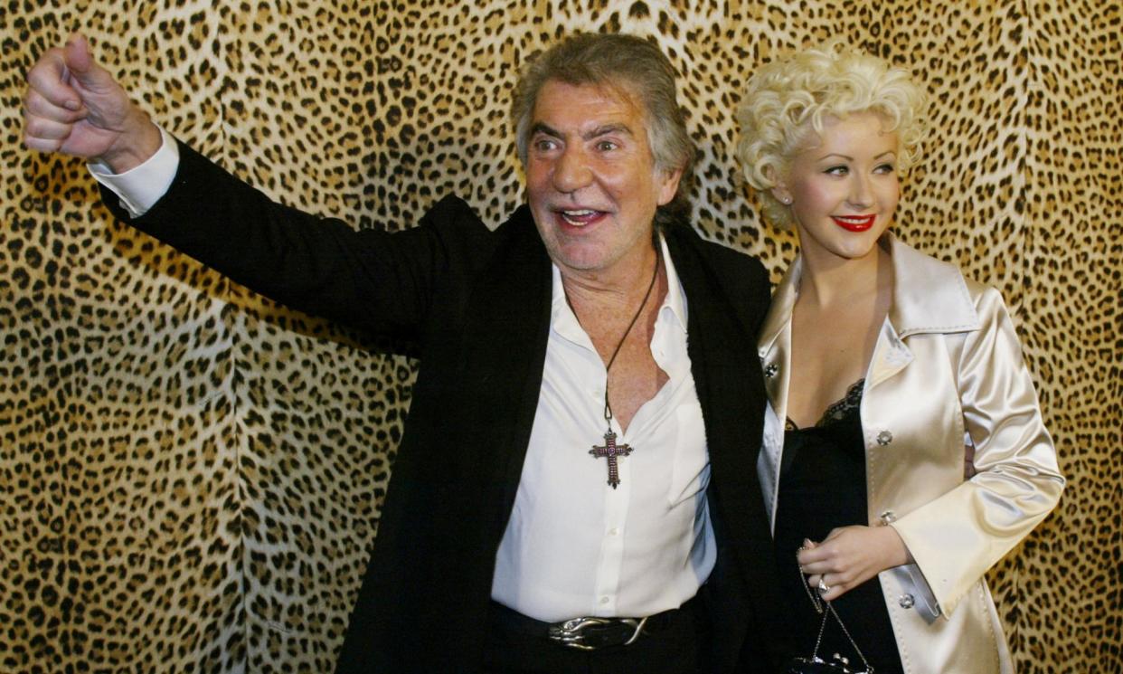 <span>Roberto Cavalli and the singer Christina Aguilera at the opening of his boutique in Beverly Hills, California, in 2005.</span><span>Photograph: Fred Prouser/Reuters</span>