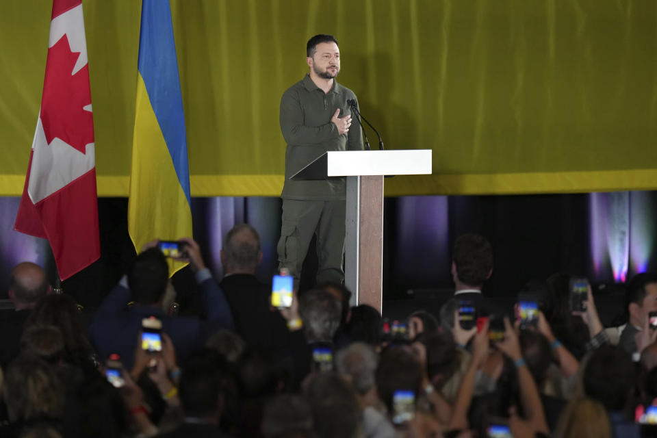 Ukrainian President Volodymyr Zelenskyy listens to an impromptu rendition of the Ukrainian national anthem at an event including members of the Ukrainian-Canadian community, in Toronto, on Friday, Sept. 22, 2023. (Chris Young/The Canadian Press via AP)
