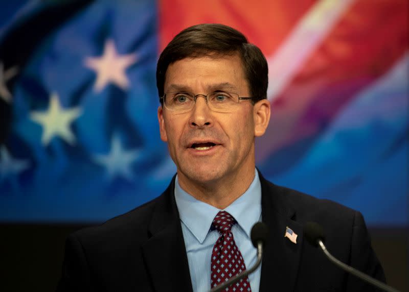 FILE PHOTO: U.S. Defense Secretary Mark T. Esper delivers remarks before ringing the closing NASDAQ bell in New York