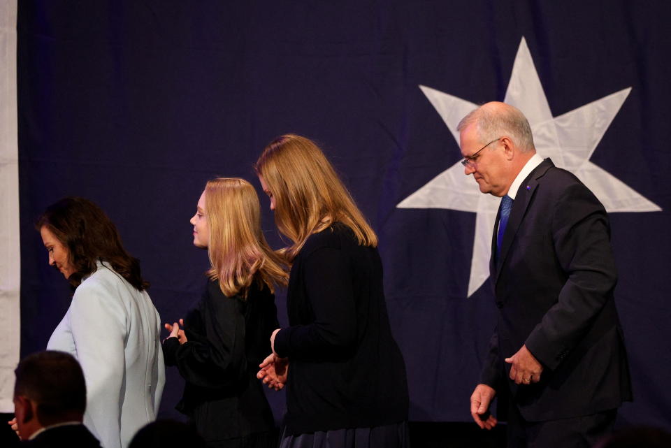 Scott Morrison leaves the stage on Saturday night with his family following the election defeat. 