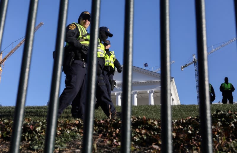 Law enforcement patrols the Virginia State Capitol grounds as gun rights advocates and militia members attend rally in Richmond, Virginia