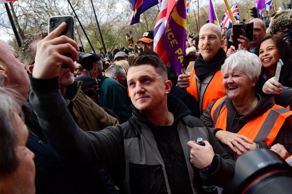 Tommy Robinson takes selfies with supporters (Getty Images)