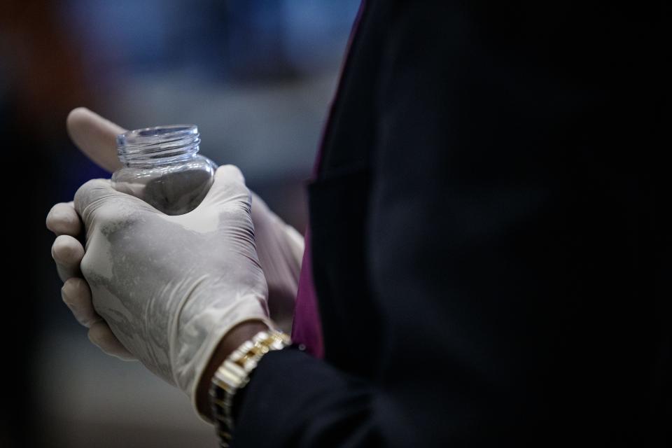 While at the Florida Capitol, people pause to pray and receive ashes as part of the Ash Wednesday tradition, March 2, 2022.