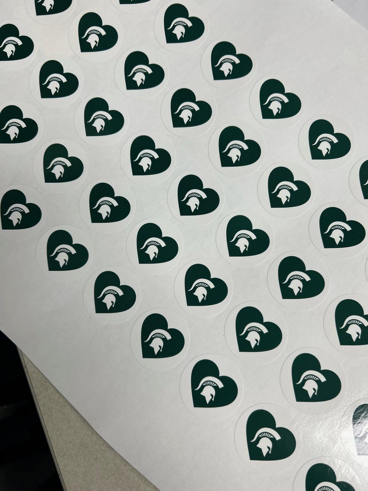 Some of the University of Michigan's athletic teams will wear special helmet decals to honor the victims at Michigan State, the school announced Wednesday, Feb. 15, 2023.