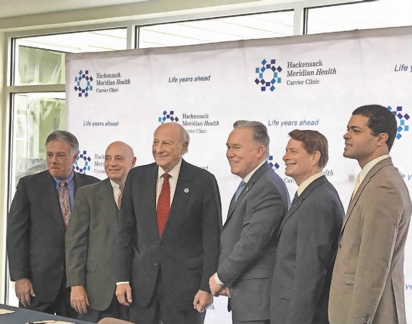 Hackensack Meridian Health and Carrier Clinic officials joined state Department of Health Commissioner Shereef Elnahal at the health care companies’ merger announcement in Belle Mead on Thursday, Jan. 3, 2019.