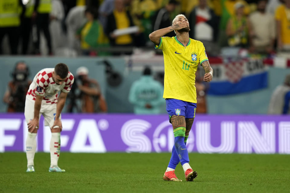 Brazil's Neymar celebrates after scoring his side's opening goal besides Croatia's Josip Juranovic during the World Cup quarterfinal soccer match between Croatia and Brazil, at the Education City Stadium in Al Rayyan, Qatar, Friday, Dec. 9, 2022. (AP Photo/Martin Meissner)