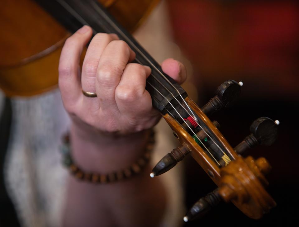 Sarah Pirkle, program director for the Junior Appalachian Musicians of North Knox, plays the fiddle during a weekly Old Time Jam at Jig & Reel on Tuesday, September 19, 2023.