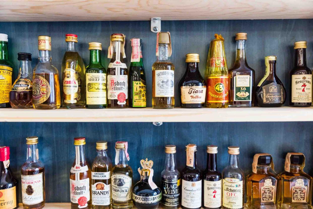 mini bottles of various liquors on shelves