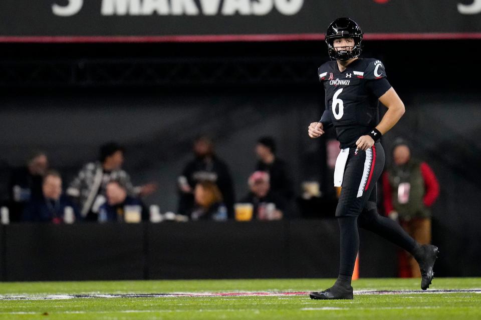 Cincinnati Bearcats quarterback Ben Bryant (6) runs off the field for throwing an interception in the second quarter of the NCAA American Athletic Conference game between the Cincinnati Bearcats and the East Carolina Pirates at Nippert Stadium in Cincinnati on Friday, Nov. 11, 2022.