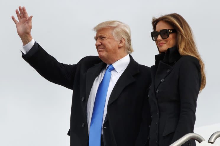 Melania Trump wears a black military-inspired coat as she arrives at Andrews Air Force Base, Thursday, Jan. 19, 2017, in Andrews Air Force Base, Md. (Photo: AP)