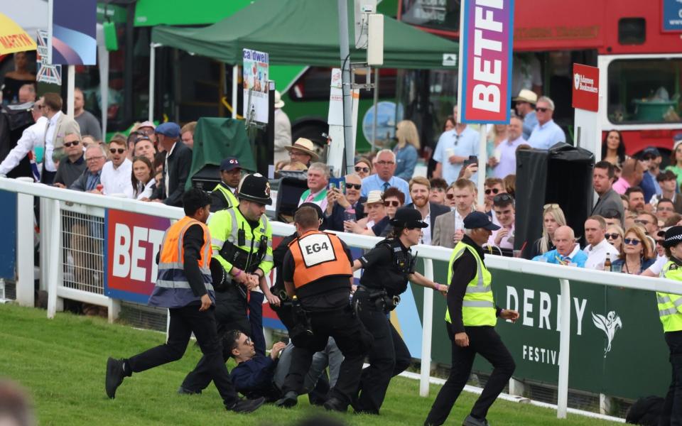 Epsom Derby protestor - Telegraph/Geoff Pugh