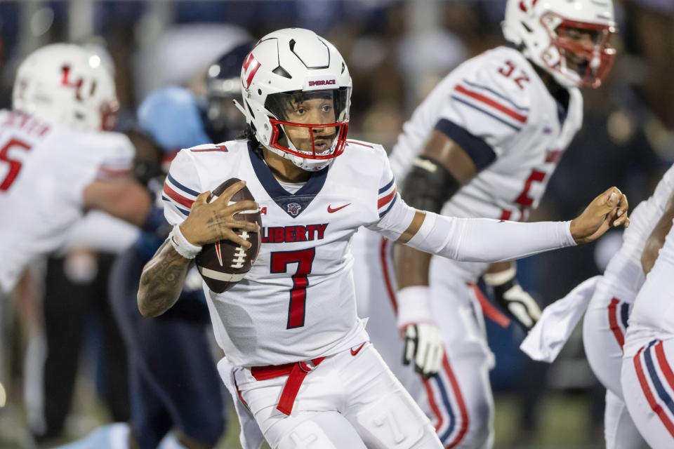 Liberty quarterback Kaidon Salter (7) runs with the ball during the game against FIU on Sept. 23 in Miami. (AP Photo/Doug Murray)