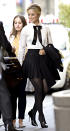 <p><em>Glee</em> grad Agron classed up her schoolgirl look with a bow and a crisp white shirt. She added a pleated short skirt and some stilettos to earn an “A” for style. (Photo: Jason Webber/Splash News) </p>