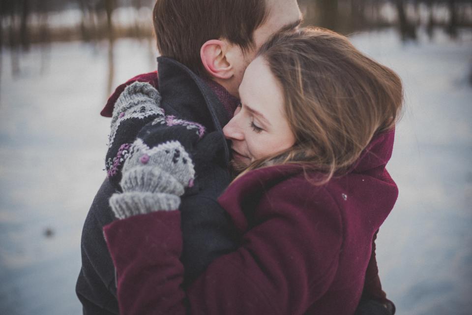 hug couple hugging love dating winter cold