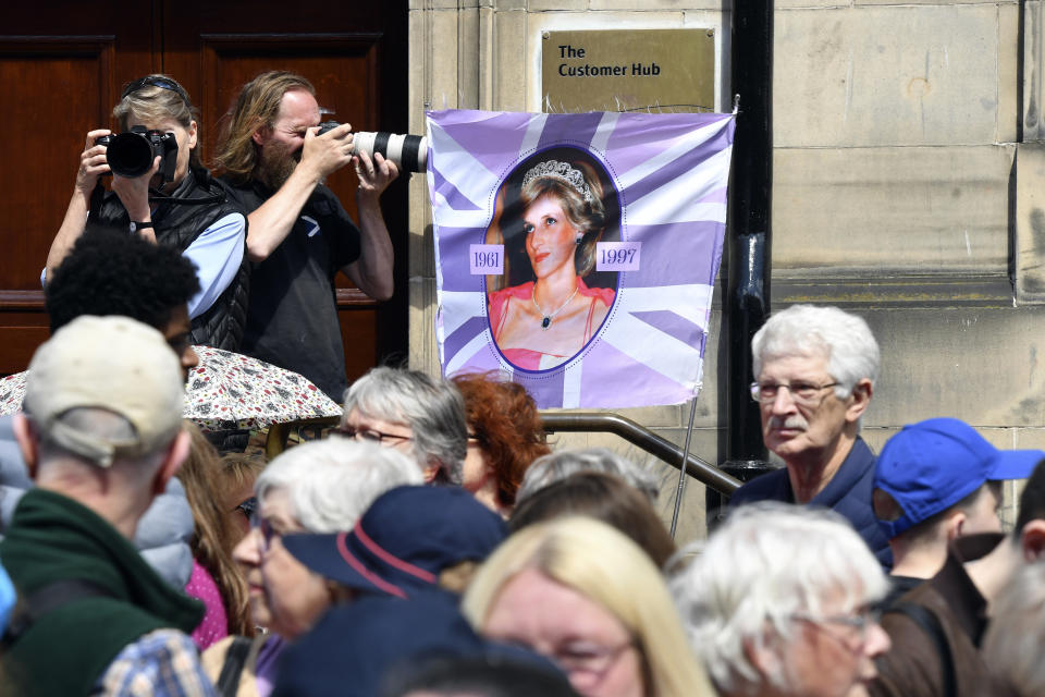 A placard featuring an image of the late Diana, Princess of Wales, is displayed outside St Giles' Cathedral, ahead of the National Service of Thanksgiving and Dedication for Britain's King Charles III and Queen Camilla, and the presentation of the Honours of Scotland, in Edinburgh, Scotland, Wednesday July 5, 2023. Two months after the lavish coronation of King Charles III at Westminster Abbey in London, Scotland is set to host its own event to mark the new monarch’s accession to the throne. (Mark Runnacles/Pool Photo via AP)