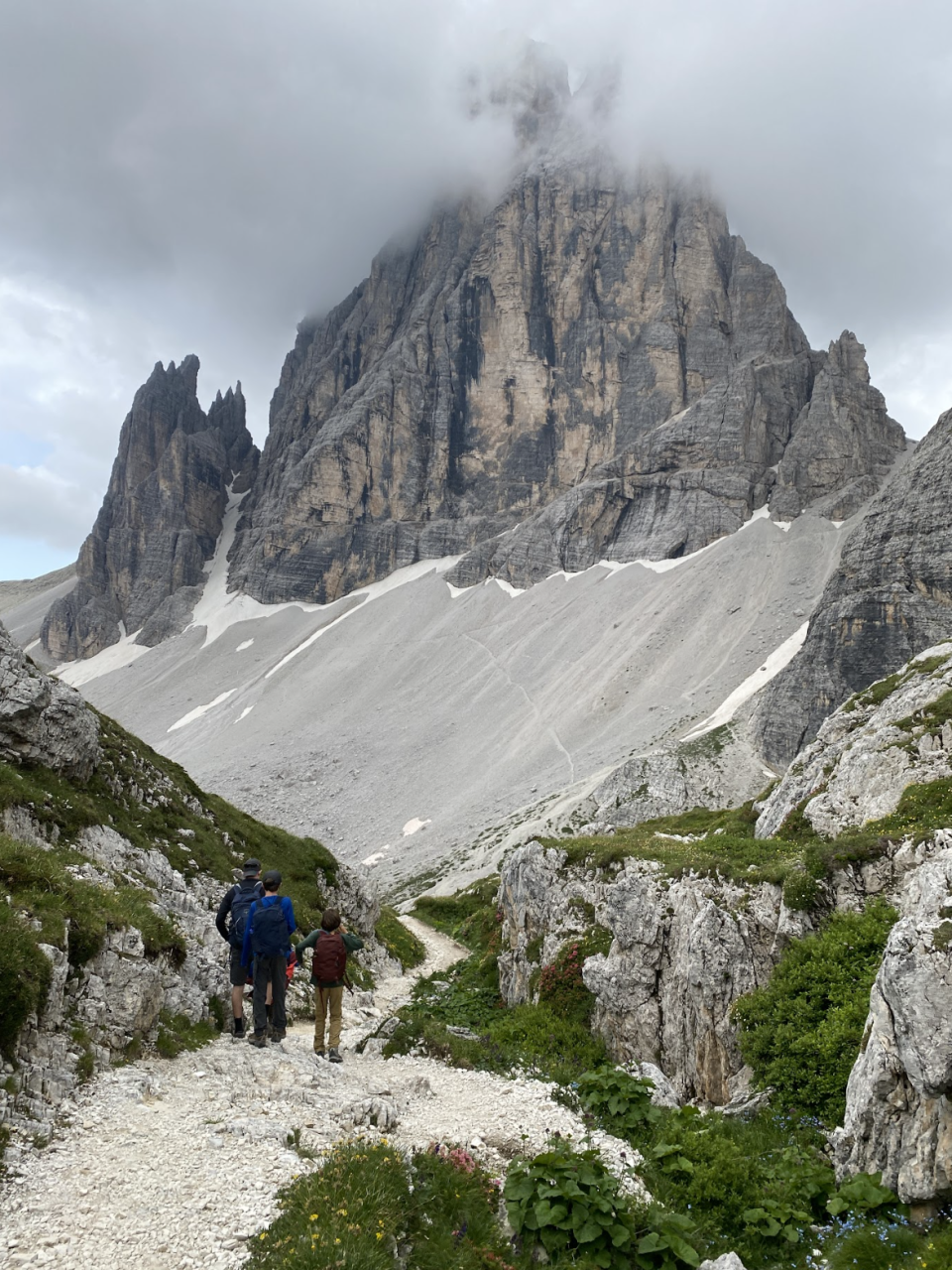 Three people on a hike in the Dolomites