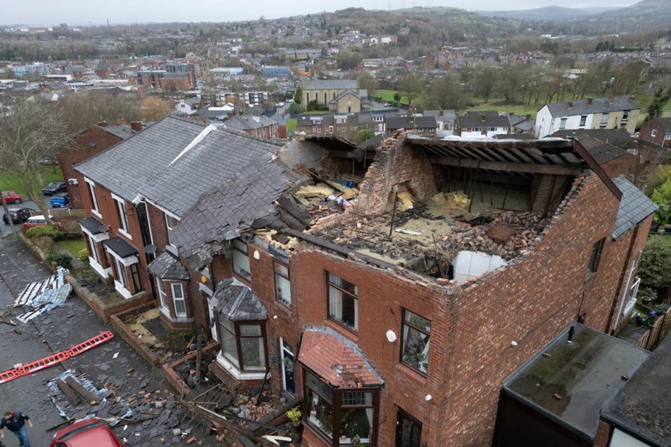 Scores of homes were damaged in Tameside on Wednesday night (AP)