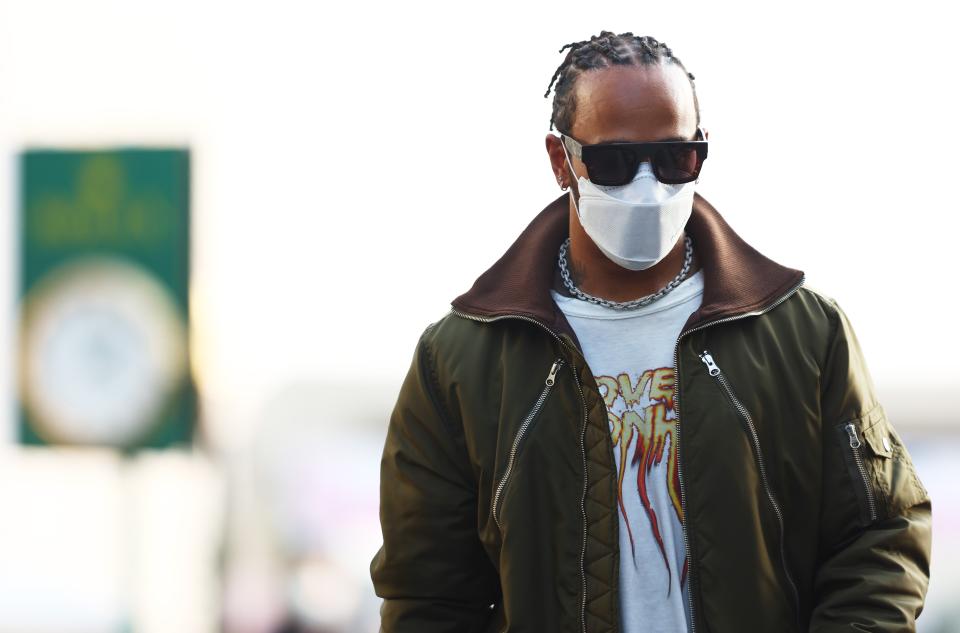 Lewis Hamilton of Great Britain and Mercedes GP walks in the Paddock (Getty)