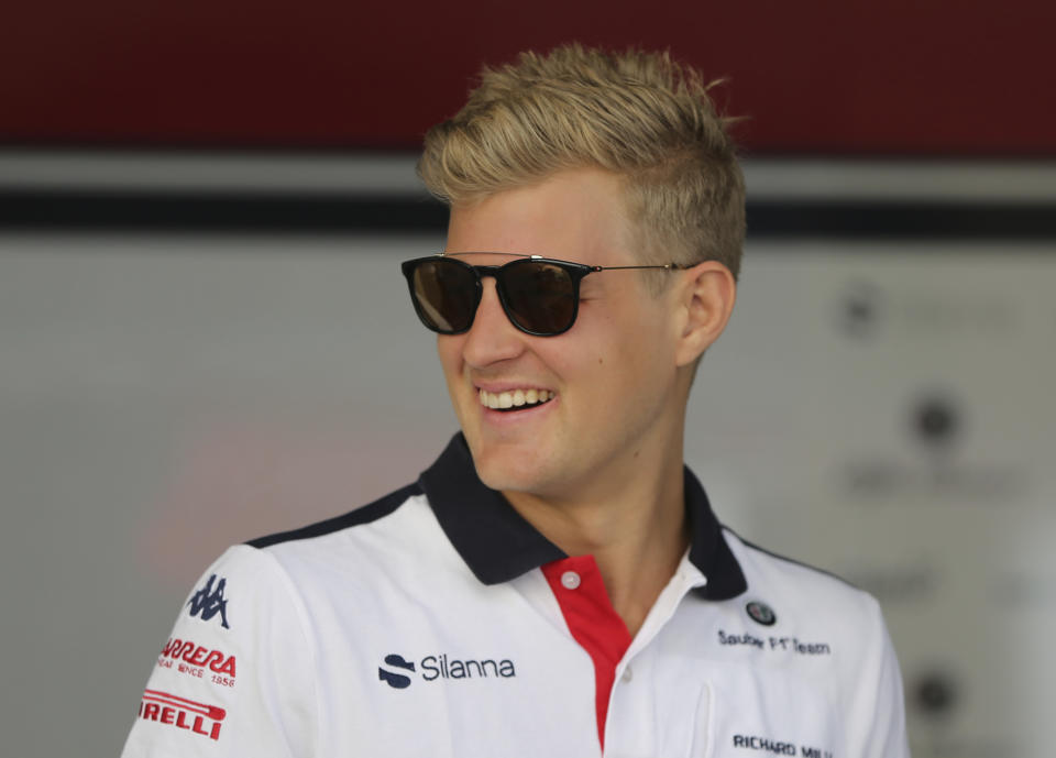 FILE - In this Nov. 22, 2018, file photo, driver Marcus Ericsson of Sweden arriving at the Yas Marina racetrack in Abu Dhabi, United Arab Emirates. The IndyCar season opens Sunday, March 10, 2019, in St. Petersburg, Fla. Among the newcomers are Felix Rosenqvist, the new teammate to Dixon at Chip Ganassi Racing, and Marcus Ericsson, who fills Robert Wickens' seat at Arrow Schmidt Peterson Motorsports. (AP Photo/Kamran Jebreili, File)