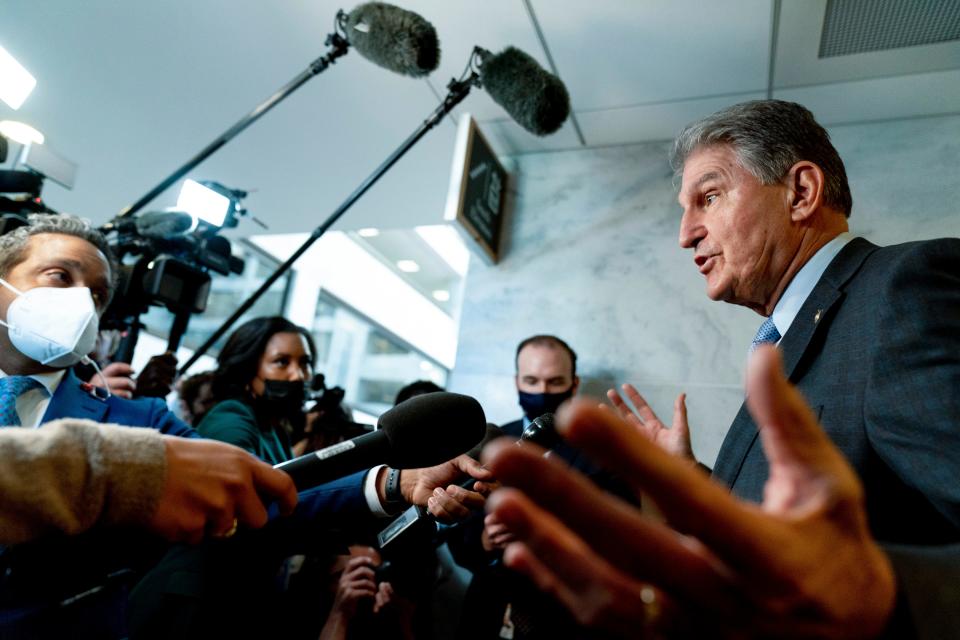 Sen. Joe Manchin, D-W.Va., a key holdout vote on President Joe Biden's domestic agenda, speaks to reporters on Capitol Hill on Oct. 27, 2021.