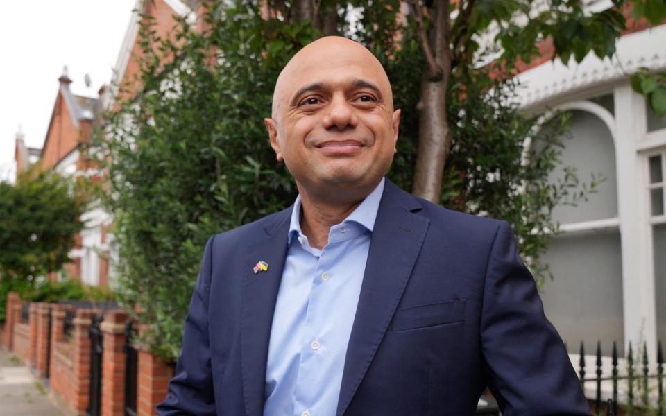 Sajid Javid smiles as he leaves his home in London today after quitting as health secretary last night - Maja Smiejkowska/Reuters