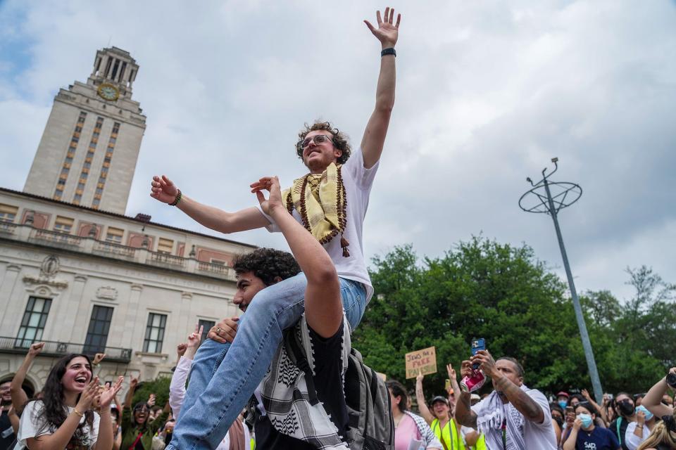 Ammer Qaddumi, one of the protesters arrested on Wednesday, April 24,2024, participates in a chant outside the Main Building on campus. Professors, students, and supporters of UT-Austin demonstrated on campus on Thursday, April 25, 2024