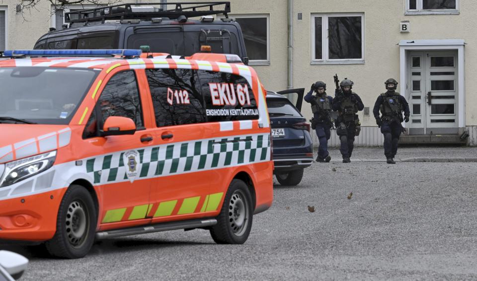 Finnish police officers, police vehicles and an ambulance are seen at the primary Viertola comprehensive school where a child opened fire and injured three other children, on April 2, 2024 in Vantaa, outside the Finnish capital Helsinki. Police said, that the attacker was in custody, and "All those involved in the shooting incident are minors".