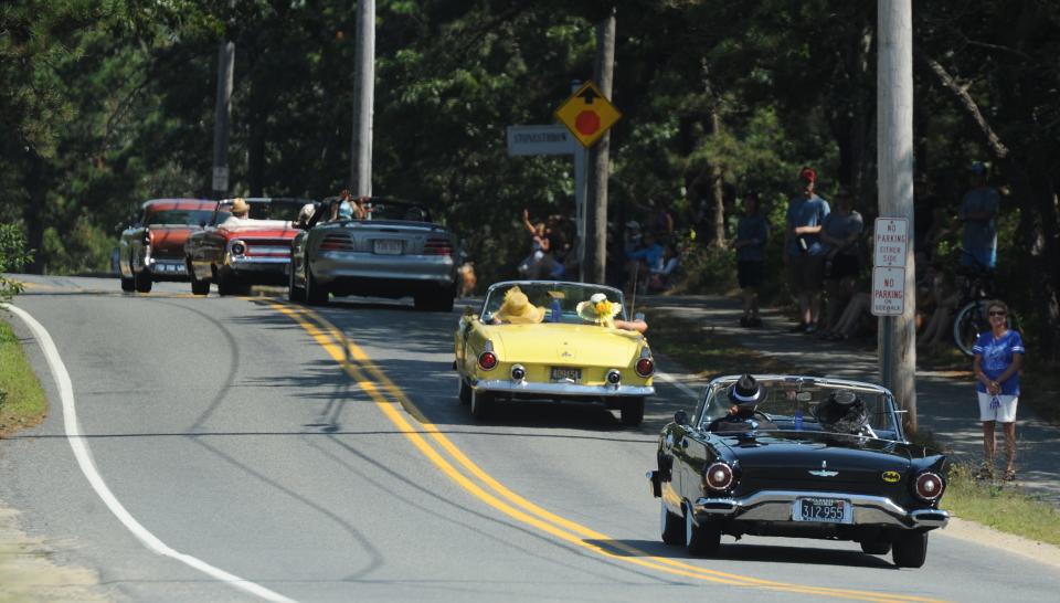 Antique and classic car drivers head up Lighthouse Road as they start out Sunday late morning for the annual car parade. About 200 antique cars were part of the 2020 Dennis Chamber of Commerce Antique Car Parade. Drivers with cars dating back as far as the 1920s navigated the roads of Dennis starting at West Dennis Beach.