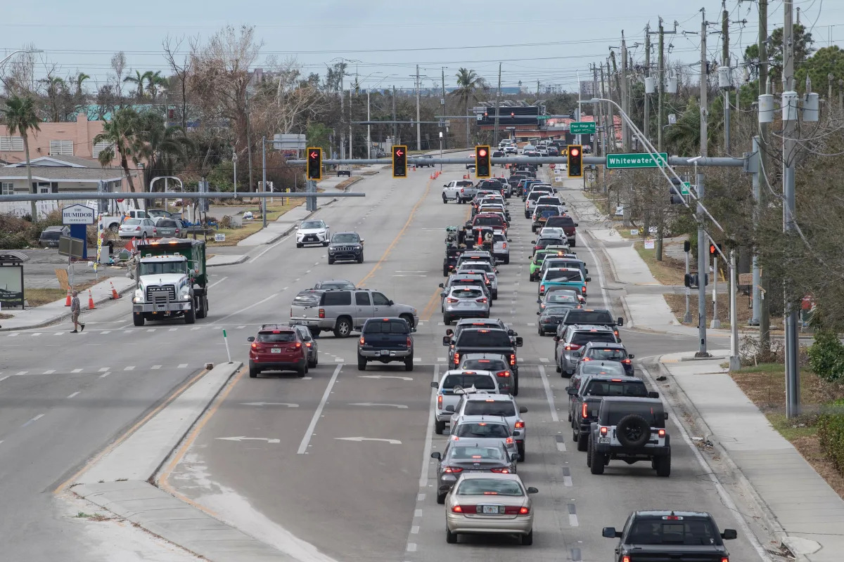 Fort Myers Beach residents line up for miles on Sunday morning as Estero Island ..
