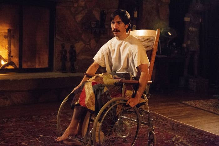 Justin Long sits in a wheel chair