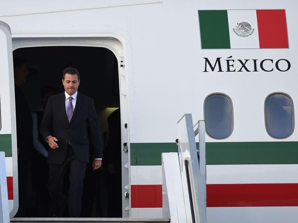 Mexico's President Enrique Pena Nieto leaves the 787 plane upon arrival at the CATAM military airport in Bogota, on August 6, 2018.