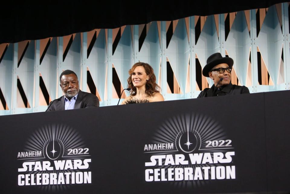 ANAHEIM, CALIFORNIA - MAY 28: (L-R) Carl Weathers, Emily Swallow and Giancarlo Esposito attend the panel for “The Mandalorian” series at Star Wars Celebration in Anaheim, California on May 28, 2022. (Photo by Jesse Grant/Getty Images for Disney)