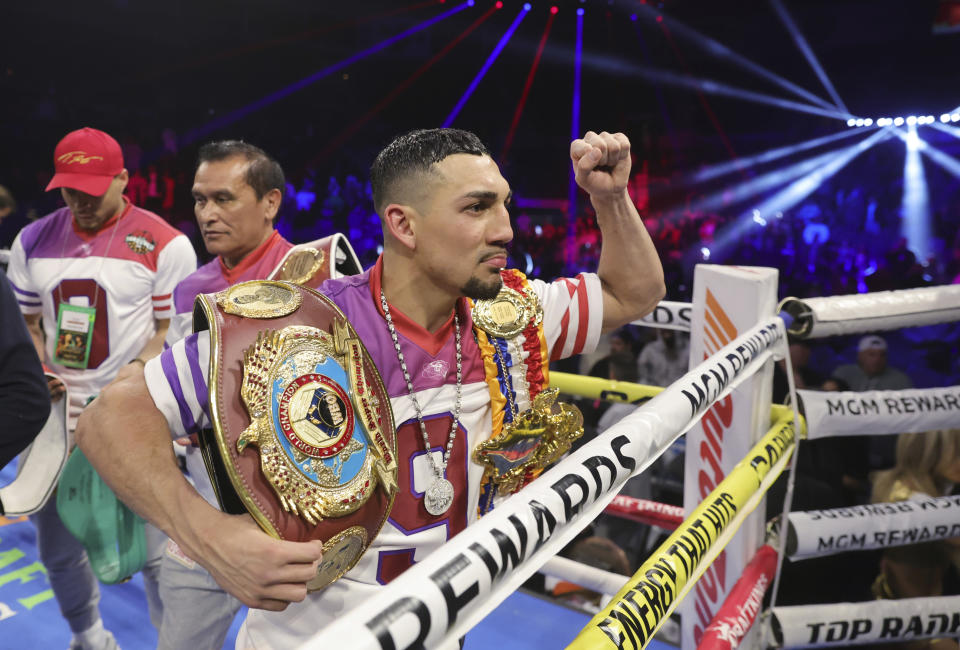 WBO junior welterweight champion Teofimo Lopez gestures to the audience after defeating Jamaine Ortiz in a boxing bout Thursday, Feb. 8, 2024, in Las Vegas. Lopez retained his title with a unanimous decision. (Steve Marcus/Las Vegas Sun via AP)