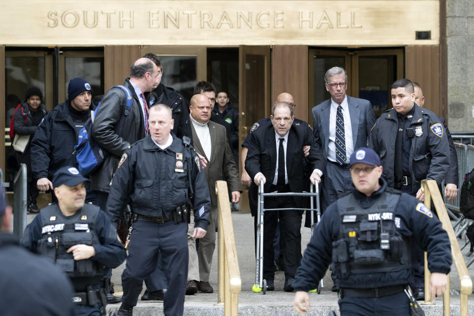 Harvey Weinstein, third from right, is surrounded by court officers as he leaves court following a pre trial hearing, Monday, Jan. 6, 2020, in New York. The disgraced movie mogul faces allegations of rape and sexual assault. (AP Photo/Mary Altaffer)