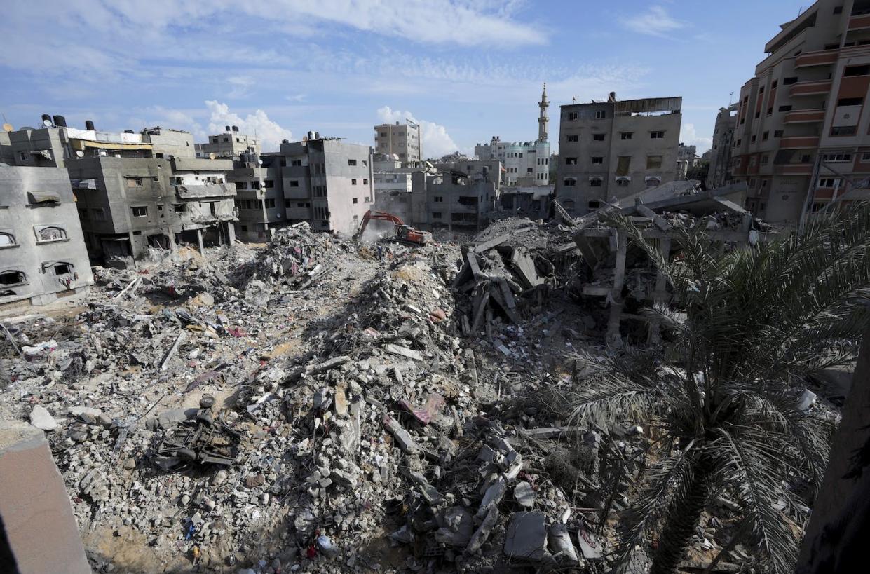 The scene in the Bureij refugee camp following an Israeli bombardment of the Gaza Strip on Nov. 14, 2023. <a href="https://newsroom.ap.org/detail/IsraelPalestiniansBuriedInRubble/8cbb263c97d94eed9d66f53d553e2a3f/photo?Query=gaza%20destruction&mediaType=photo&sortBy=&dateRange=Anytime&totalCount=735&currentItemNo=15&vs=true&vs=true" rel="nofollow noopener" target="_blank" data-ylk="slk:AP Photo/Adel Hana;elm:context_link;itc:0;sec:content-canvas" class="link ">AP Photo/Adel Hana</a>