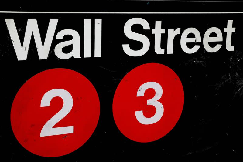 FILE PHOTO: FILE PHOTO: FILE PHOTO: A sign for the Wall Street subway station is seen in the financial district in New York