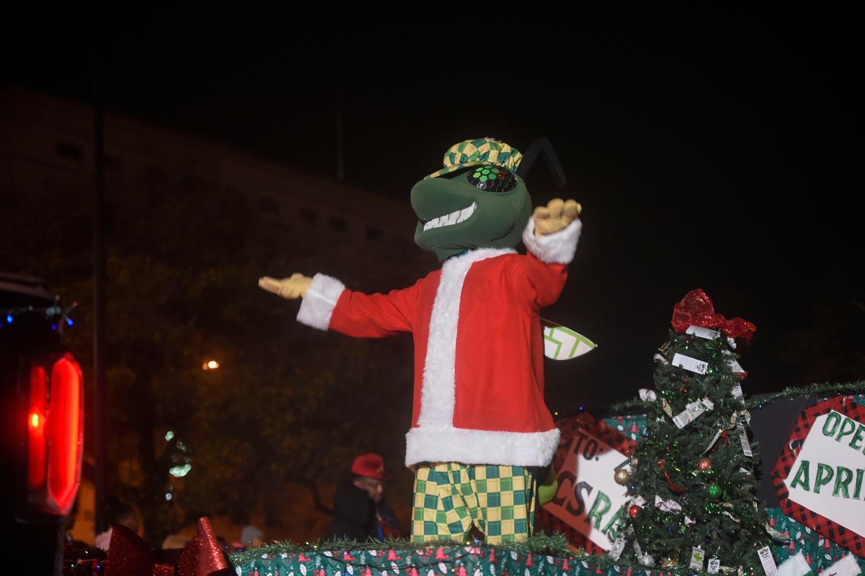 FILE - Auggie with the Augusta GreenJackets rides in the Augusta Christmas Parade down Broad Street on Saturday, Dec. 10, 2022. Auggie's Holiday BUZZar is Dec. 9 at the GreenJackets home: SRP Park in North Augusta.