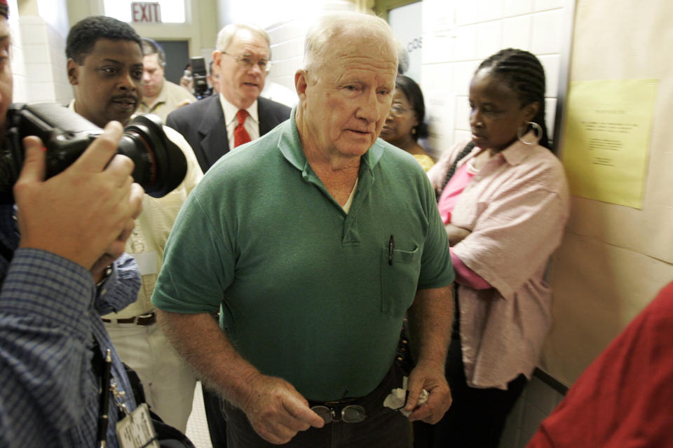 FILE - In this May 10, 2007, file photo, retired Alabama state trooper James Bonard Fowler, center, leaves the Perry County Sheriff's Office after turning himself in Marion, Ala., for the shooting death of Jimmie Lee Jackson in 1965. Fowler pleaded guilty in 2010 to manslaughter and served five months in jail. (AP Photo/Rob Carr, File)