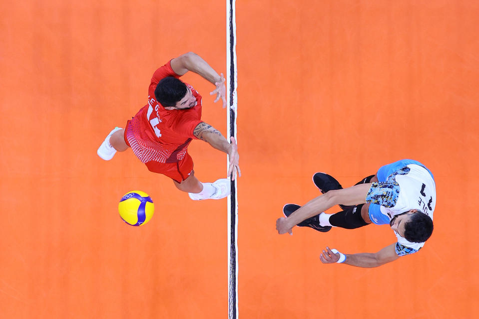 <p>TOKYO, JAPAN - JULY 28: Sebastian Sole #11 of Team Argentina hits past Nicolas le Goff #14 of Team France during the Men's Preliminary Round - Pool B volleyball on day five of the Tokyo 2020 Olympic Games at Ariake Arena on July 28, 2021 in Tokyo, Japan. (Photo by Toru Hanai/Getty Images)</p> 