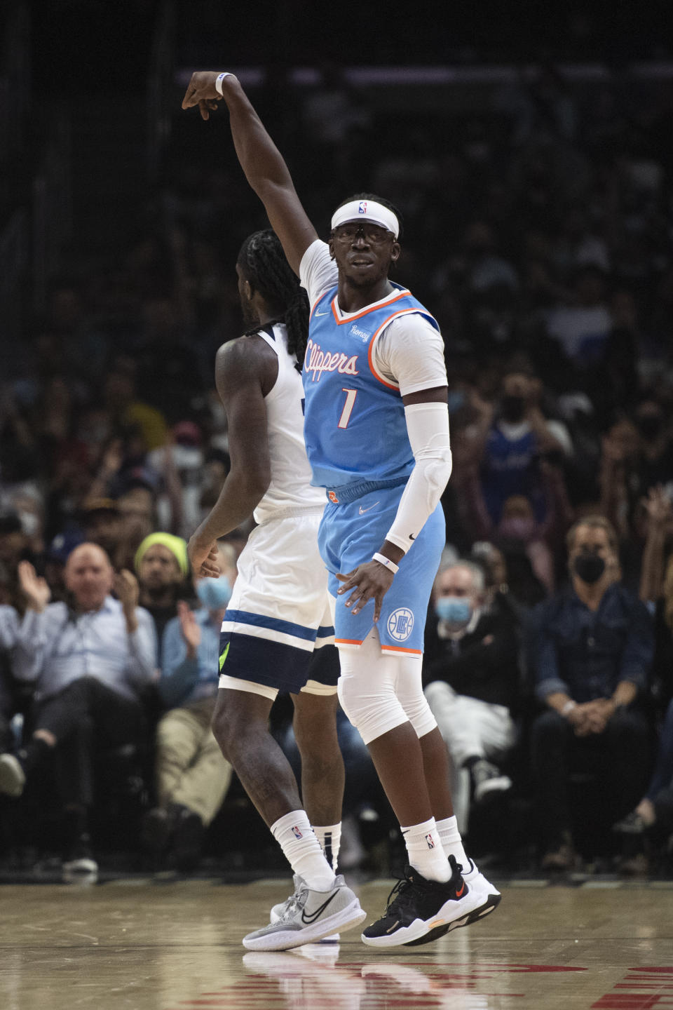 Los Angeles Clippers guard Reggie Jackson (1) reacts after scoring a basket during the first half of an NBA basketball game against the Minnesota Timberwolves in Los Angeles, Saturday, Nov. 13, 2021. (AP Photo/Kyusung Gong)