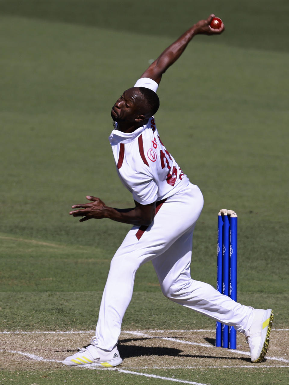 West Indies' Kemar Roach bowls to Australia on the first day of their cricket test match in Adelaide, Australia, Wednesday, Jan. 17, 2024. (AP Photo/James Elsby)