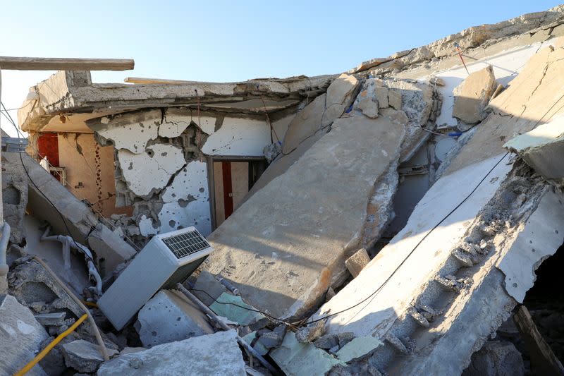 FILE PHOTO: Damage is seen after shells fell on a residential area, in Abu Slim district south of Tripoli