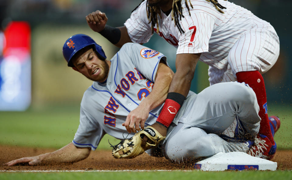 New York Mets' Steven Matz, left, is tagged out by Philadelphia Phillies third baseman Maikel Franco after trying to advance to third on a single by Jeff McNeil during the fourth inning of a baseball game, Monday, June 24, 2019, in Philadelphia. (AP Photo/Matt Slocum)