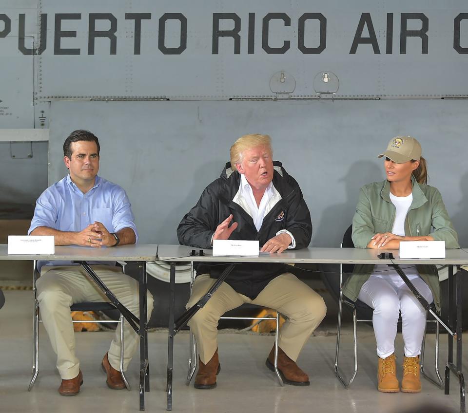 President Donald Trump, first lady Melania Trump and Puerto Rico Gov. Ricardo Rossello&nbsp;at a press briefing in Puerto Rico on Oct. 3. (Photo: MANDEL NGAN/AFP via Getty Images)