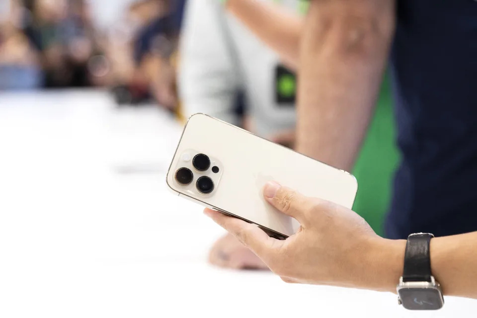 An attendee holds a caller   iPhone Pro during a motorboat  lawsuit   for caller   products astatine  Apple Park successful  Cupertino, California, connected  September 7, 2022. - Apple unveiled respective  caller   products including a caller   iPhone 14, iPhone 14 Plus, 14 Pro and iPhone 14 Pro Max. They besides  released 3  Apple watches and caller   AirPods Pros during the event. (Photo by Brittany Hosea-Small / AFP) (Photo by BRITTANY HOSEA-SMALL/AFP via Getty Images)