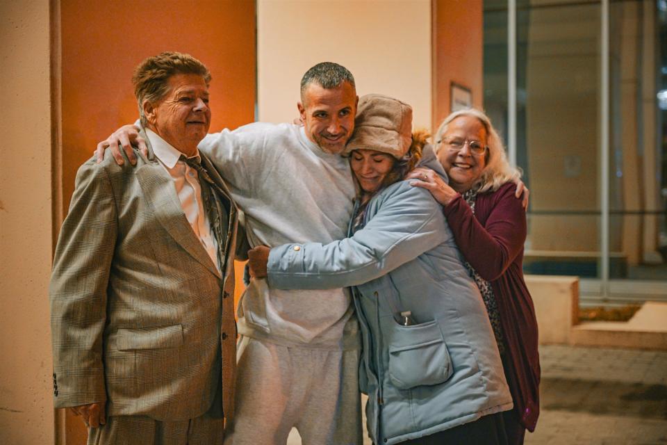 Alan J. Butts, second from left, embraces his family after his release from the Franklin County jail Thursday night after serving nearly 20 years in prison. A Franklin County judge has granted him bond and a new trial in the "'shaken baby" death of his girlfriend's 2-year-old son in 2002. Butts is pictured with, from left: his dad John Butts, his sister Aimee Wissman, and his mom Denise Horn.