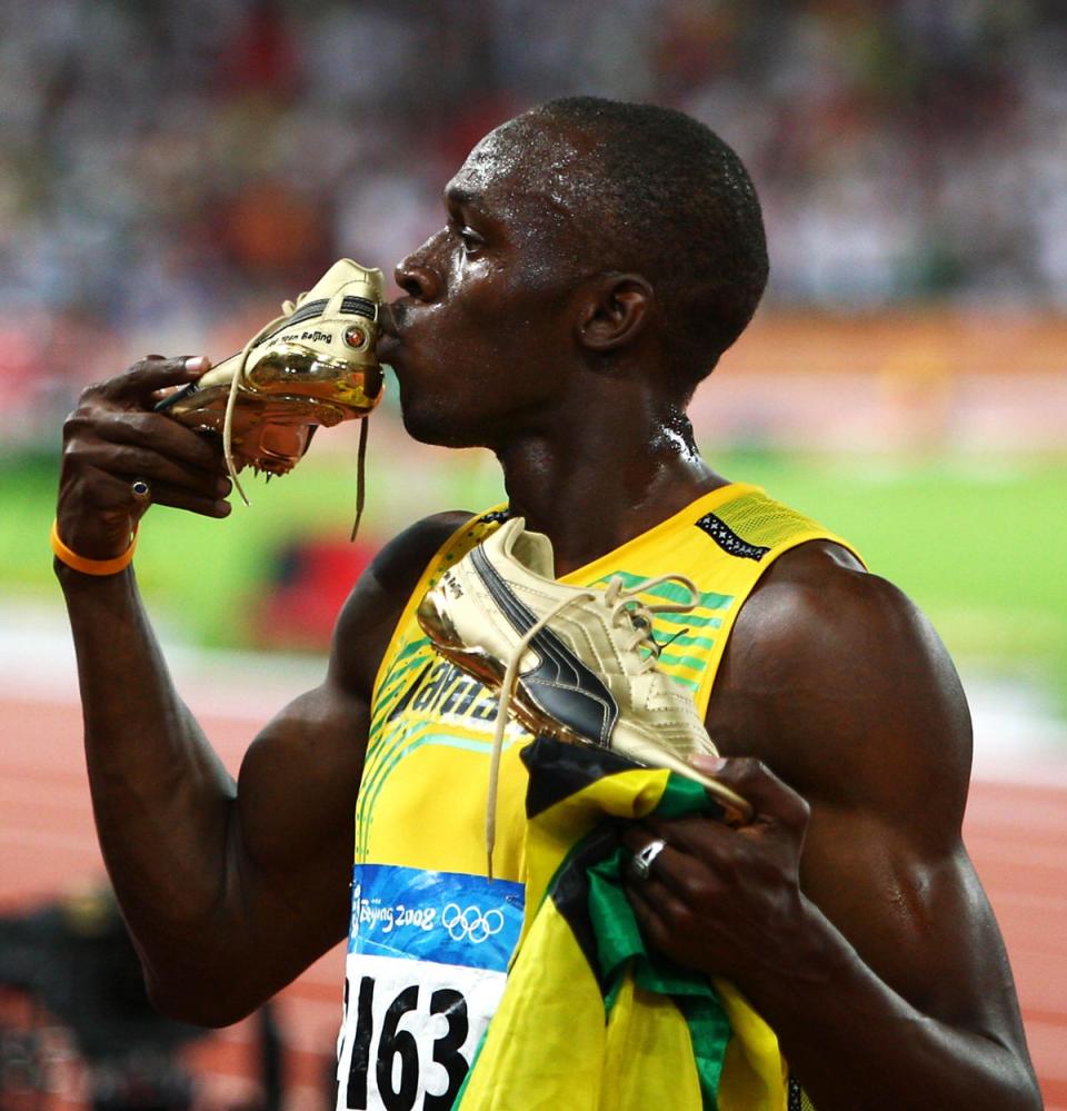 Usain Bolt kisses his golden shoe after the race (Andrew Milligan/PA) (PA Archive)