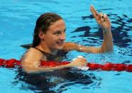 Katinka Hosszu (HUN) of Hungary celebrates setting a new world record and winning the gold medal. REUTERS/Marcos Brindicci